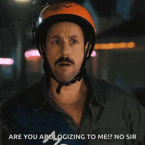 a man wearing an orange helmet says are you apologizing to me