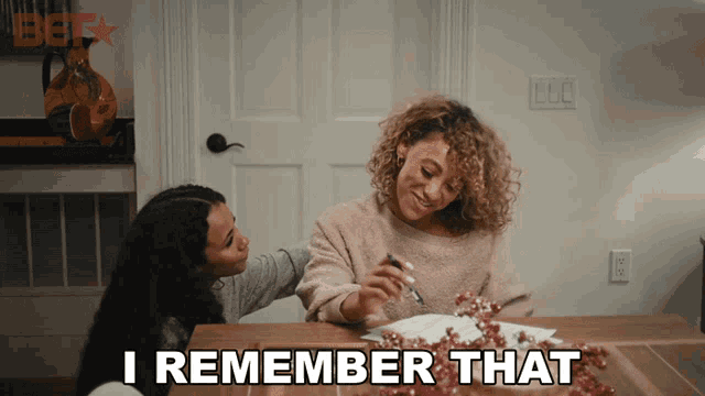 two women sitting at a table with the words " i remember that " in the corner