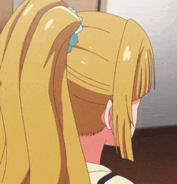 a girl with long blonde hair is wearing a ponytail with a blue bow