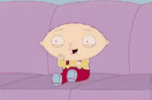 a cartoon character from family guy is sitting on a couch .