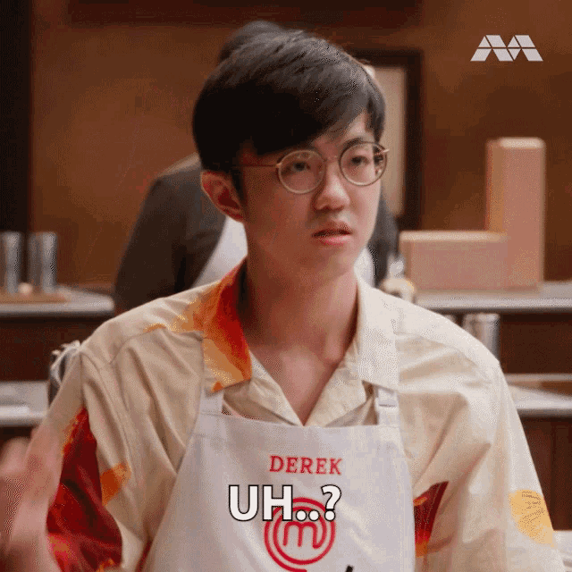 a young man wearing an apron that says derek uh ?