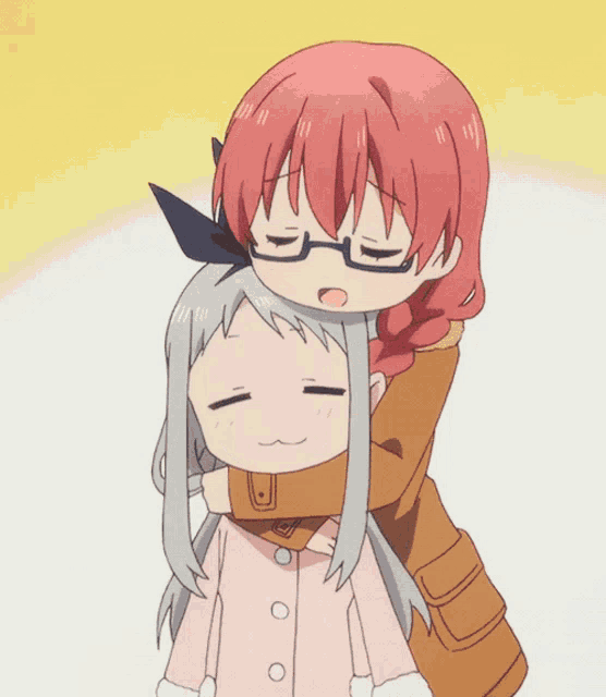 a girl with red hair and glasses is hugging another girl
