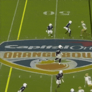 a football player jumps in the air while wearing number 1