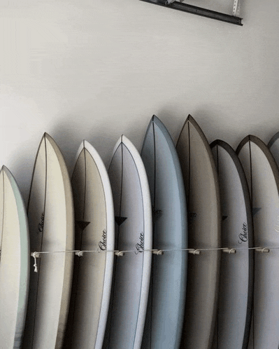 a row of surfboards with choice written on the side