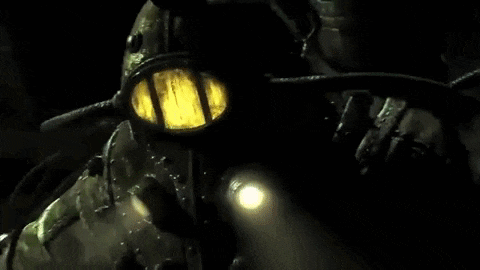 a person is riding a motorcycle in a dark room with a yellow light on the front .