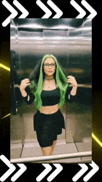 a woman with green hair is in an elevator
