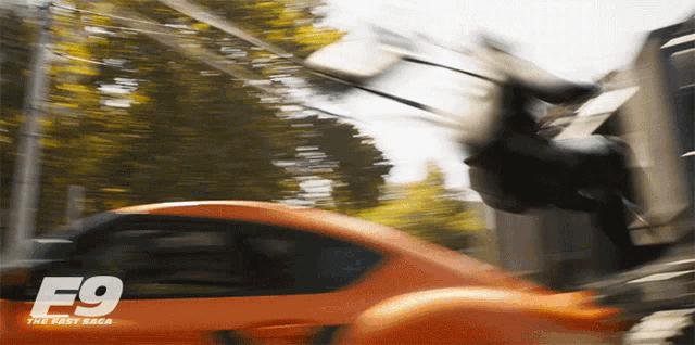 a movie poster for fast and furious 9 shows a man jumping from a car