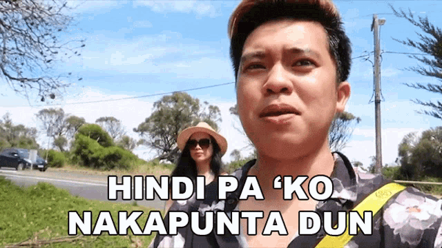 a man and a woman are standing next to each other with the caption hindi pa ko nakapunta dun