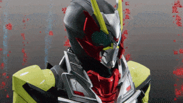 a close up of a masked rider 's face with chinese writing behind him