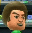 a close up of a cartoon character 's face with a green shirt and brown hair .