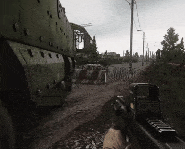 a person holding a gun with a scope that says eotech