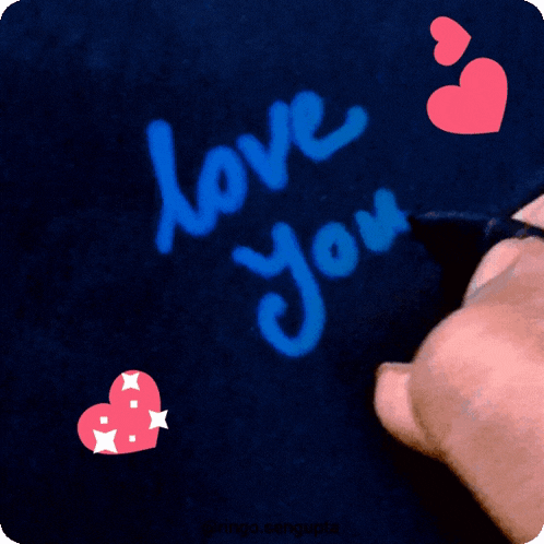 the word love is written on a dark background