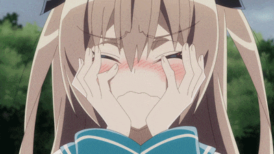 a girl with blonde hair is covering her face with her hands and making a face