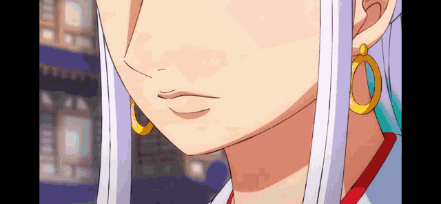 a close up of a woman 's face with earrings