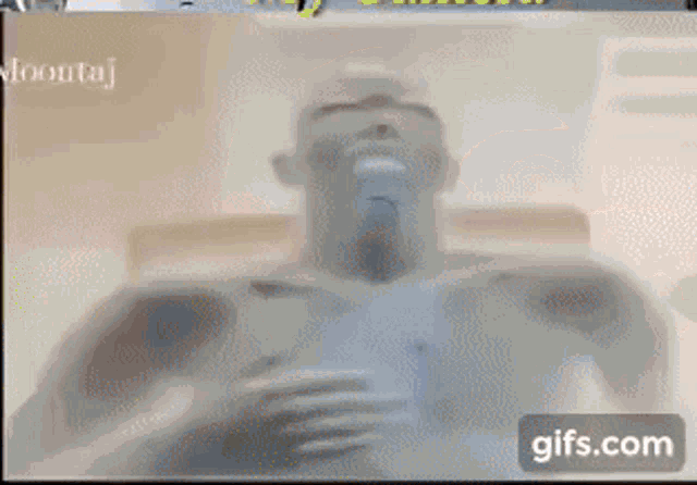 a close up of a person 's face with glowing eyes and a gifs.com button in the corner .