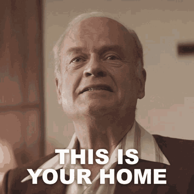 an older man says " this is your home " in front of him