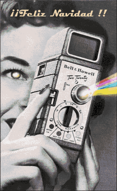 a woman holding a bell & howell two twenty camera