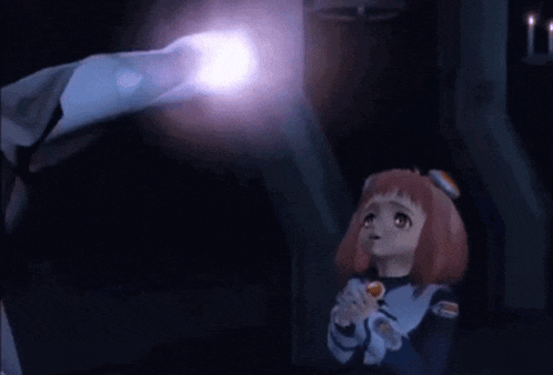 a man and a girl are standing next to each other in a dark room . the girl is holding a light .