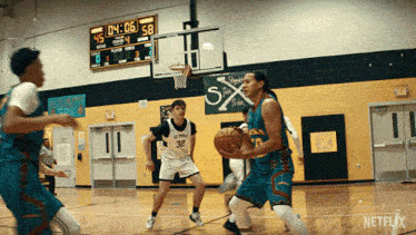 a basketball game is being played in a gym with a scoreboard that says 4:06 58