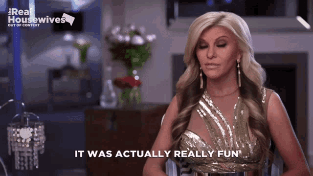 a woman says it was actually really fun in front of a sign that says real housewives
