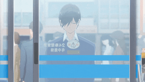a man is standing in front of a store with chinese writing on it