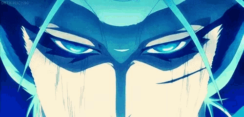 a close up of a person 's face with a mask on and blue eyes .