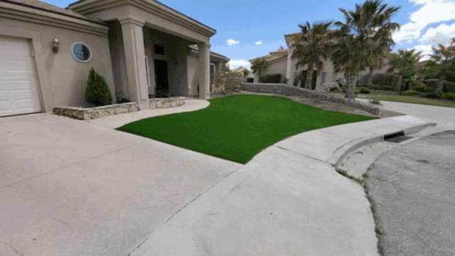 a house with a green lawn and a white garage door