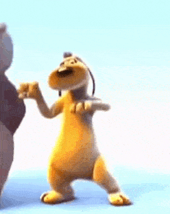 a stuffed animal is dancing next to a teddy bear on a blue surface .