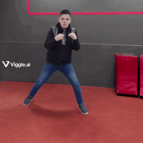 a man is standing in front of a wall that says viggle.ai