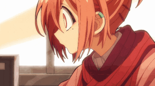 a close up of a girl with red hair and a red scarf around her neck