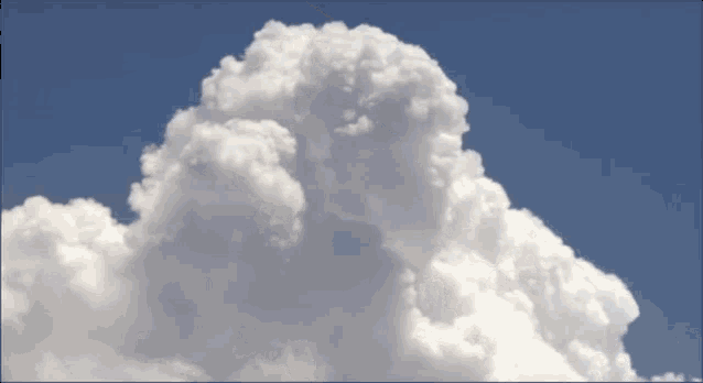 a large white cloud in the sky looks like a nuclear explosion