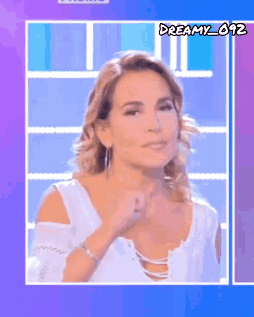 a woman in a white top with the name dreamy_692 on the bottom