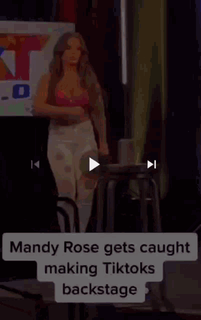 mandy rose gets caught making tiktoks backstage while standing on a stage