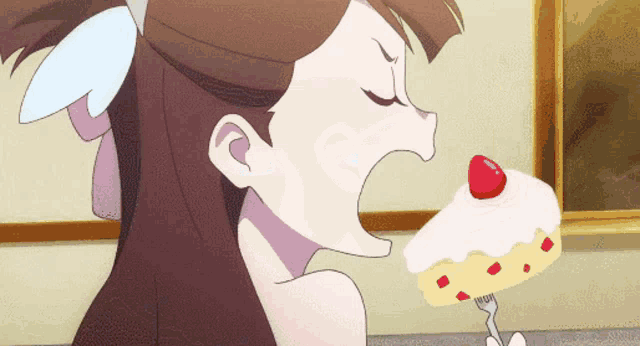 a girl is eating a piece of cake with a cherry on top
