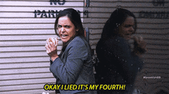 a woman is eating a hot dog and says okay i lied it 's my fourth