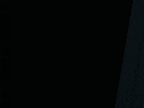 a light is shining through a dark room