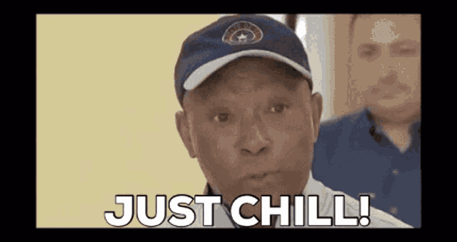 a man wearing a baseball cap says " just chill "