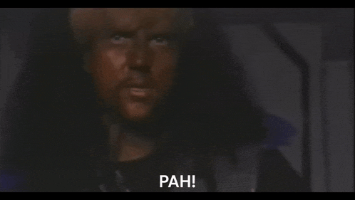 a blurred image of a man with the word pah on the bottom left
