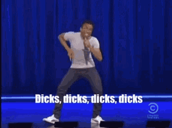 a man is dancing on a stage with the words dicks dicks dicks dicks written above him .