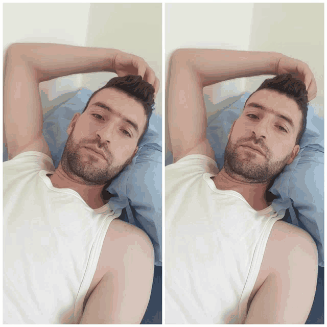 a man with a beard is laying on a bed with his arms outstretched