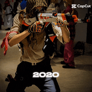 a man in a costume holding a gun with the year 2020 below him