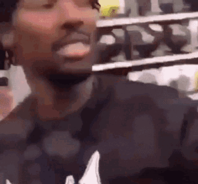 a close up of a man 's face with his tongue out in a store