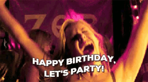 a woman is celebrating her birthday with her arms in the air