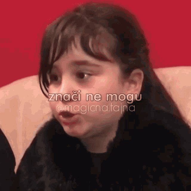 a little girl sitting on a couch with the words znaci ne mogu on the bottom right