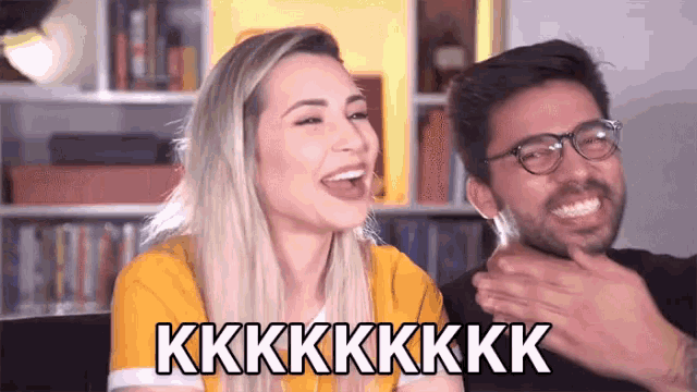 a man and a woman are laughing and the woman says kk