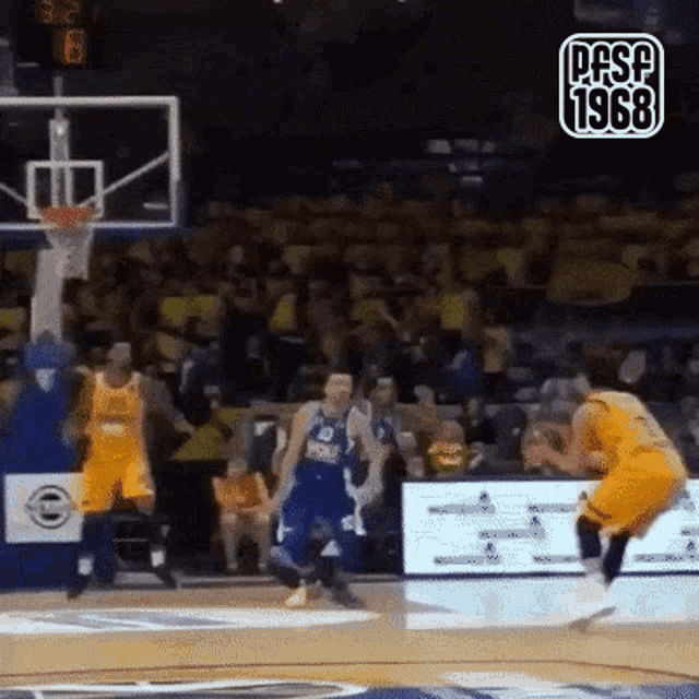 a basketball game is being played on a court with the year 1968 on the bottom right