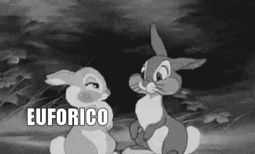 two rabbits are sitting next to each other in a black and white cartoon and the word euforico is on the bottom .