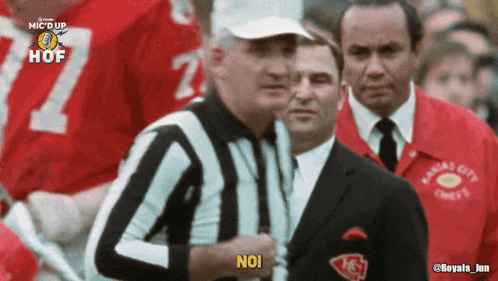 a referee says no in front of a kansas city chiefs jersey