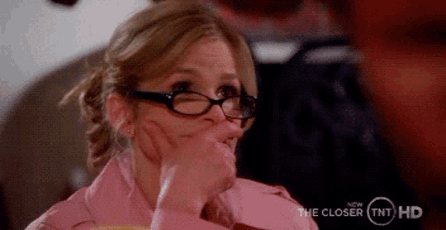 a close up of a woman wearing glasses with the words the closer tnt hd