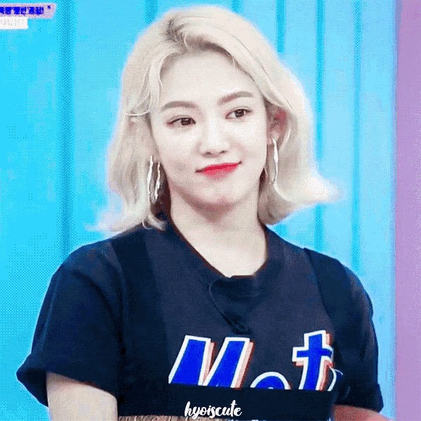 a woman with blonde hair is wearing a black t-shirt with the word met on it .